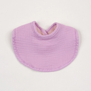 Close-up of soft purple multilayer muslin cotton baby bib showing high-quality fabric texture