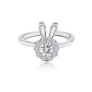 Revolving rabbit ring with zircon stones and halo setting in silver minimalist style