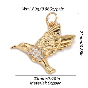 Detailed copper hummingbird pendant with cubic zirconia inlay and 23mm dimension specs
