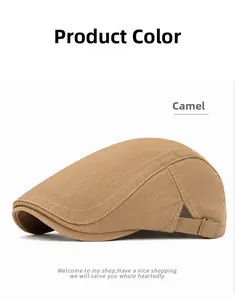 Detail of camel cotton beret showing twill texture and metal buckle adjustment