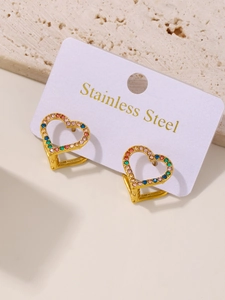 Macro detail of gold stainless steel heart earrings with colorful pave zircon stones