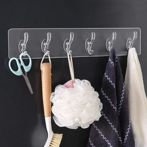 Strong adhesive 6-hook rack for wall storage showing hanging kitchen and bath tools