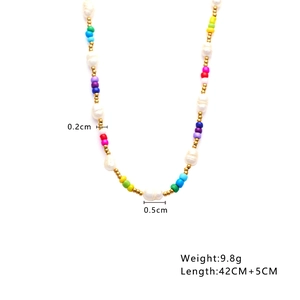 Detail view of bohemian beaded necklace with white pearls and color beads showing size specs
