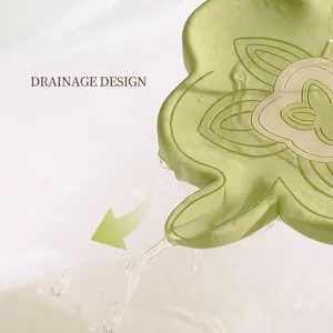 Light green petal-shaped silicone soap dish with drainage design for anti-slip storage