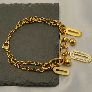Double-layered 18k gold plated stainless steel bracelet with geometric crystal pendants