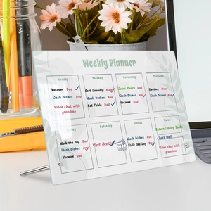 Detail view of transparent acrylic weekly planner board on a desk with metal stands