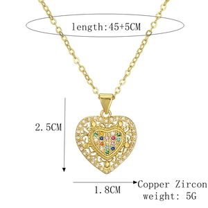 Detail view of gold heart necklace with zircon inlay showing 2.5cm pendant dimensions