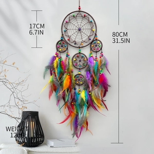 Handmade dream catcher with colorful feathers and five rings for bohemian wall decor