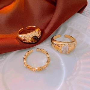 Vintage gold adjustable rings with tiger eye stone, cubic zirconia and chain link designs
