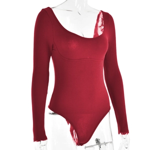 Detail of red ribbed cotton long sleeve bodysuit with U-shaped neckline on mannequin