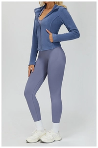 Detail of slim fit hooded fleece jacket with zip and pocket for outdoor fitness