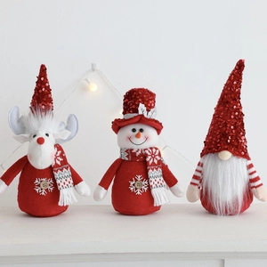 Detailed view of Christmas plush dolls featuring reindeer and snowman with sequins