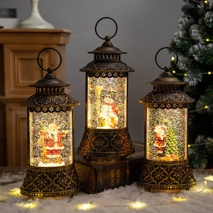 Vintage bronze Christmas lantern set with Santa and snowman figurines and glitter snow