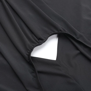 Close-up of heart-shaped cutout detail on black slim fit backless dress