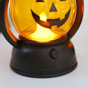 Halloween portable pumpkin LED lamp with yellow shade and black base for spooky decor