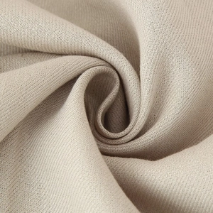 Women's khaki sleeveless vest and trousers set featuring textured twill fabric detail
