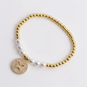 Elegant beaded bracelet with gold copper beads, white pearls, and zircon butterfly pendant