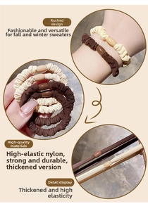 Macro detail of thick elastic scrunchies in earth tones showing strong nylon texture