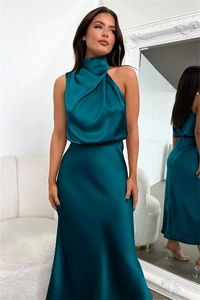 Detailed view of dark teal satin maxi dress with halter neckline and smooth silk texture