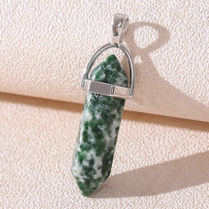 Detailed view of green moss agate hexagonal crystal point with a silver metal clasp