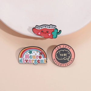 Three neurodivergent enamel pins featuring rainbow and pepper designs with text for clothing