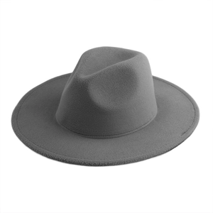 Detail of dark grey wool felt fedora showing wide flat brim and premium texture