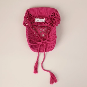 Fashionable rose red hollow hand-knitted sun hat with lace label and tassels for women