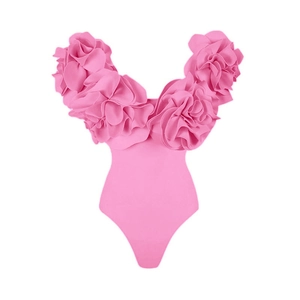 Close-up of 3D pink floral ruffles on a strapless solid one-piece swimsuit