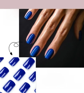 Glossy royal blue press-on nails in medium square shape shown as a full set on hand