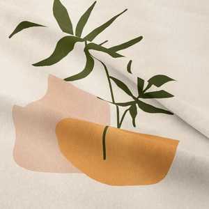 Macro detail showing woven fabric texture with beige, green, and ochre leaf patterns