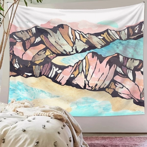 Detailed view of abstract mountain wall tapestry hanging in a cozy minimalist bedroom
