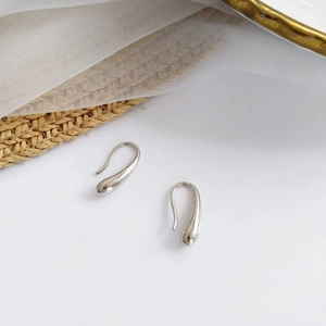 Minimalist silver teardrop earrings in polished stainless steel for a chic modern look