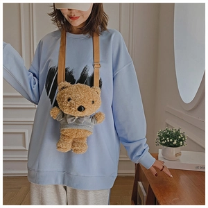 Brown plush teddy bear crossbody bag with adjustable strap and cute grey hoodie detail