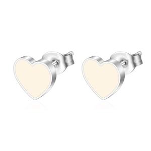 Detail of silver heart stud earrings with beige enamel inlay and metal butterfly backings
