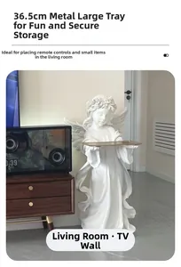 Detailed view of the 36.5cm golden metal tray held by a white vintage angel statue
