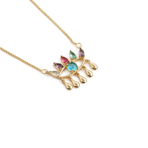 Gold evil eye crown pendant necklace with colorful stones and teardrop tassels