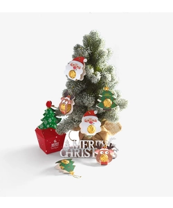 Detail of Christmas candy packaging cards featuring Santa and Reindeer cartoon designs