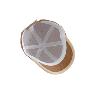 Internal view of brown corduroy kids baseball cap showing inner lining and stitching
