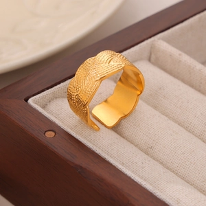 Vintage wide gold-plated open ring with engraved woven texture on wooden jewelry box