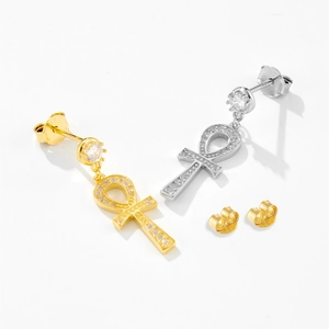 Macro shot of S925 sterling silver Ankh earrings with shimmering cubic zirconia