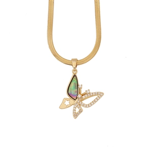Detail of gold butterfly pendant with abalone shell inlay and zircon on flat snake chain