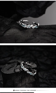 Detailed macro view of S925 silver ring with blue enamel and fluid lava texture surface