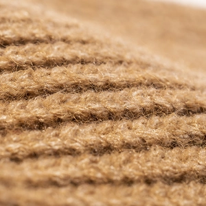 Knit beanie hat in warm camel brown with thick rib texture and plush wool finish