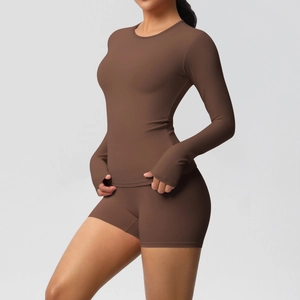 Detail of coffee brown yoga set with long sleeve thumbhole top and high waist shorts