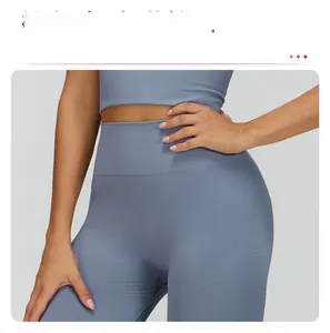 Close-up of fog blue yoga leggings with high ribbed waist and curved jacquard texture