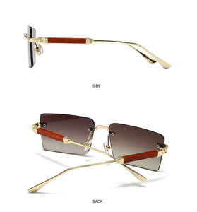 Detailansicht der goldfarbenen randlosen Rechteck-Sonnenbrille mit Bügeln in Holzoptik
