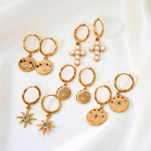 Set of six gold titanium hoop earrings featuring evil eye, cross, and star charms