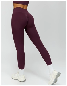 Detail view of high waist yoga pants in deep purple with scrunch butt lifting effect