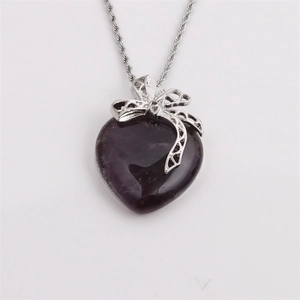Hollow bow necklace featuring a dark purple crystal heart pendant on silver rope chain