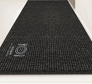 Detailed view of gray non-slip kitchen rug with vertical stripes and cutlery icon